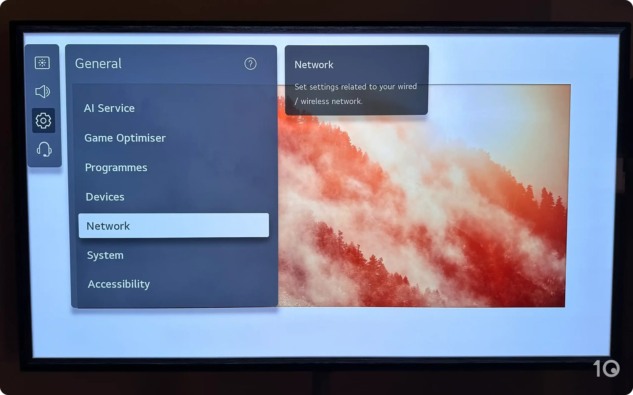 LG TV screen displaying the 'General' settings menu with the 'Network' option selected, with a tooltip indicating settings for wired or wireless network.